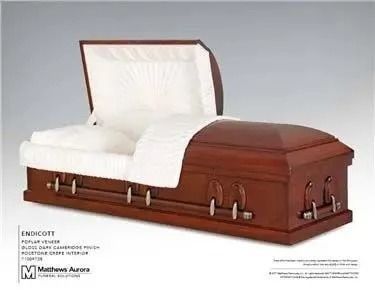 Open wooden casket with white interior lining.