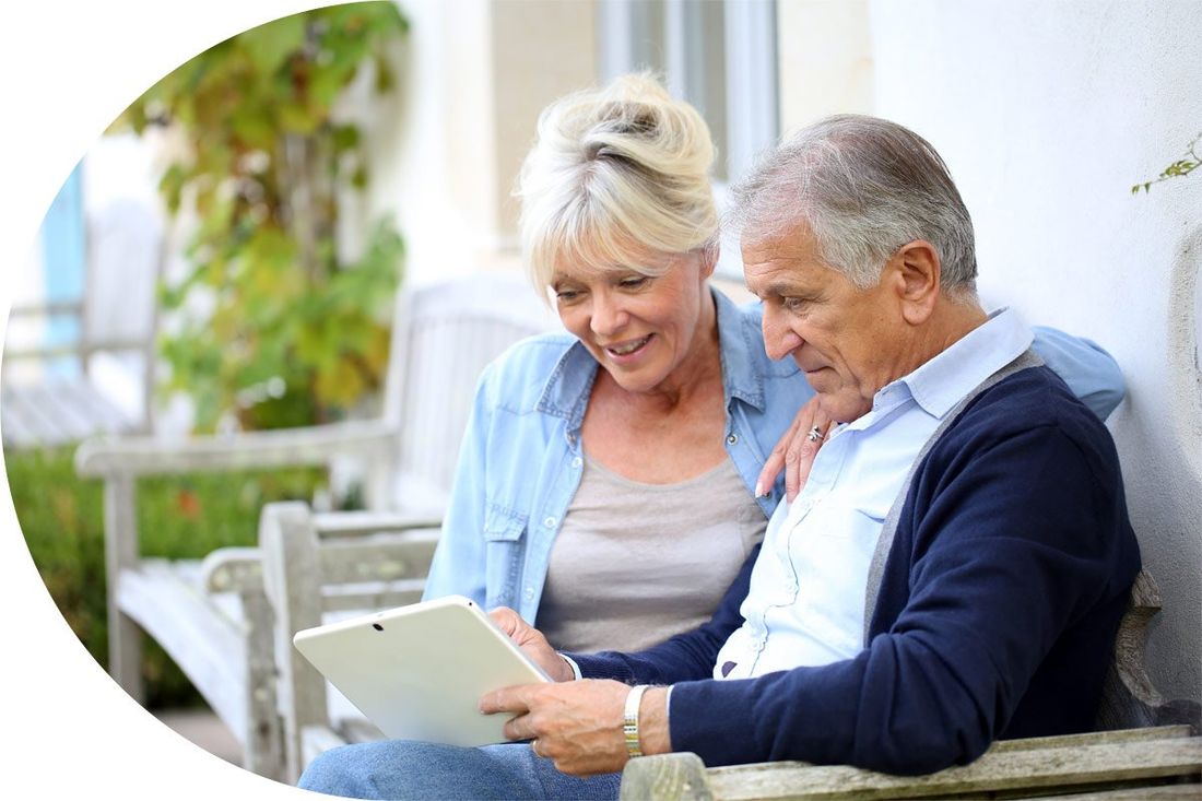 Cremation Options Couple Looking at Tablet