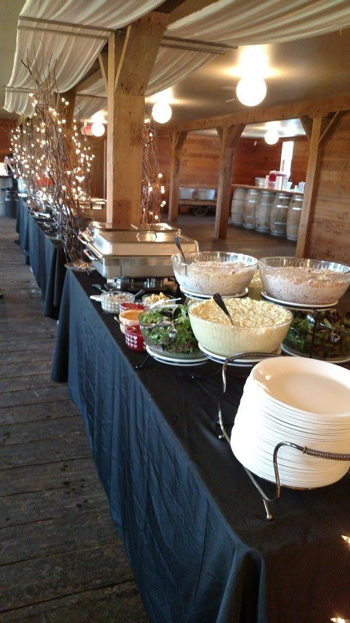 Wedding Catering — Table Setting with Glasses, Plates, Napkins and Flowers in Chehalis, WA