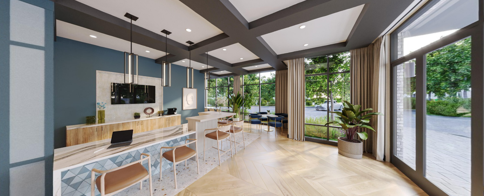 Modern, sunlit café interior with wood tables, white chairs, and large windows overlooking greenery at Vela Park apartments in East Lake, Atlanta, GA.