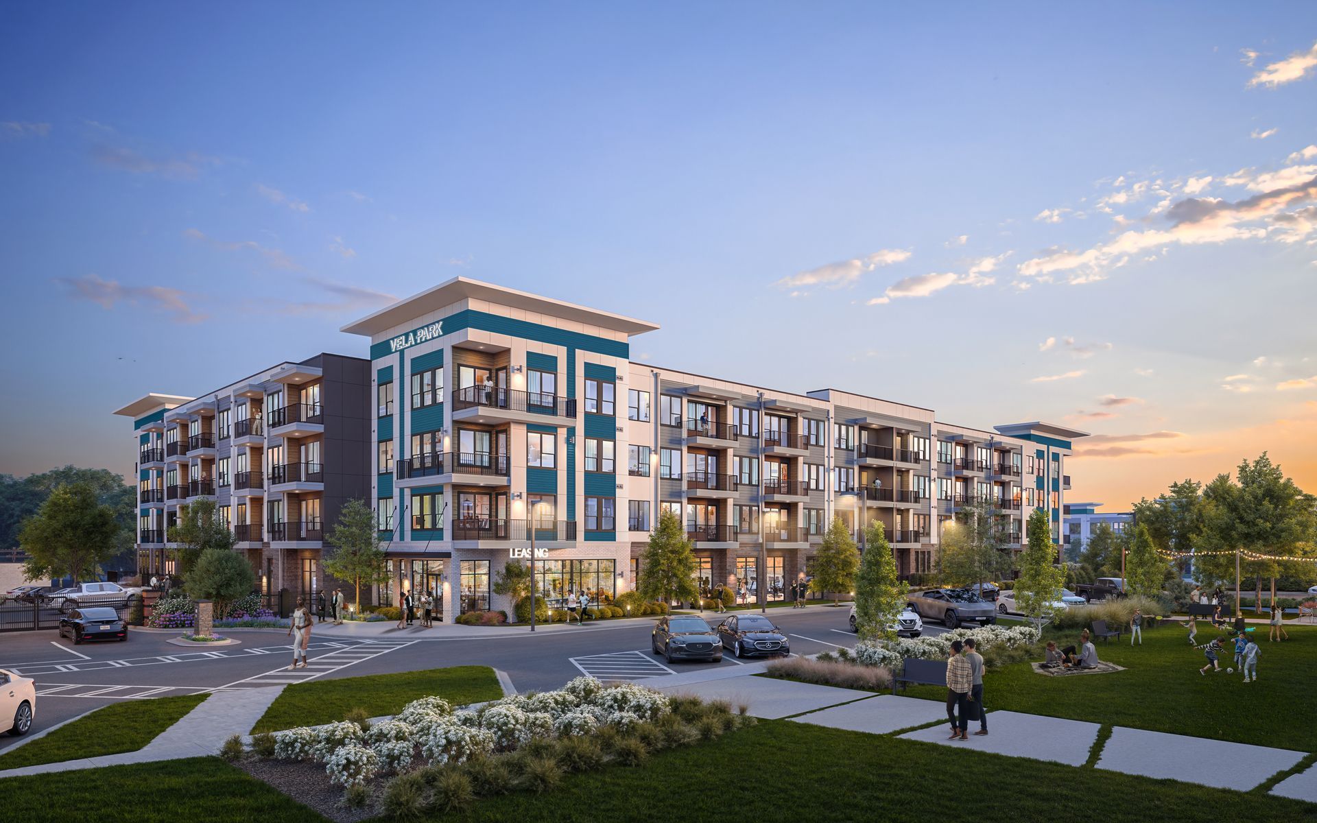Modern apartment complex at sunset with landscaped courtyard, walkways, and trees at Vela Park apartments in East Lake, Atlanta, GA.