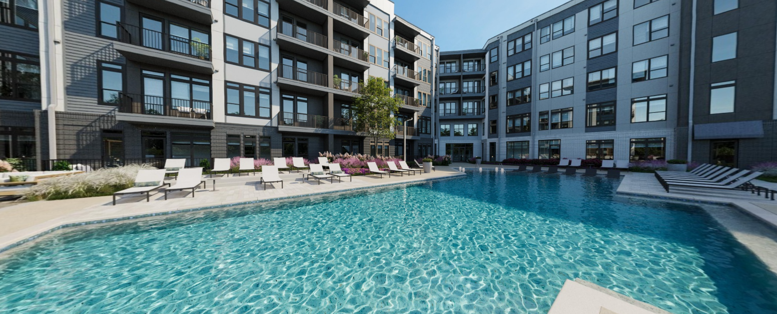 Modern apartment courtyard with a large blue swimming pool and lounge chairs at Vela Park apartments in East Lake, Atlanta, GA.