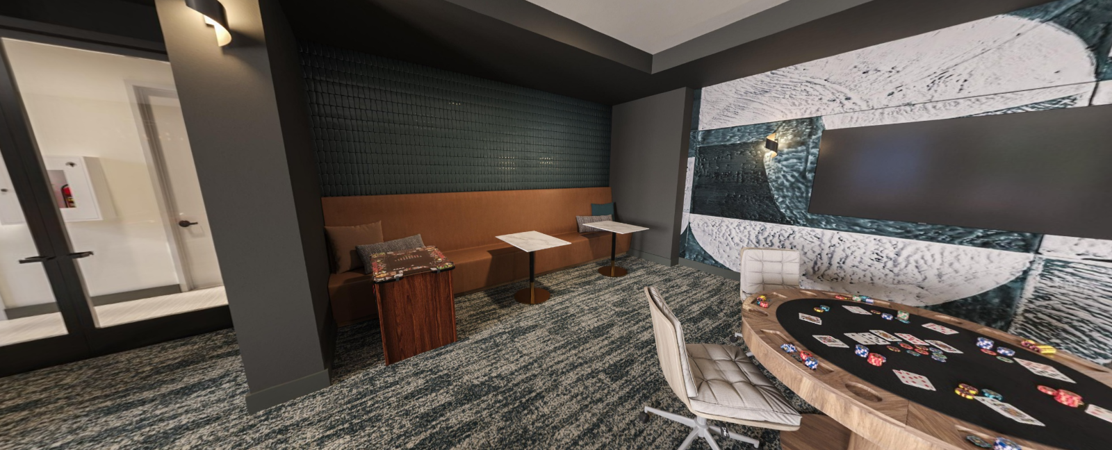 Modern lounge with a curved table, patterned chairs, wooden cabinets, and a large wall mural at Vela Park apartments in East Lake, Atlanta, GA.