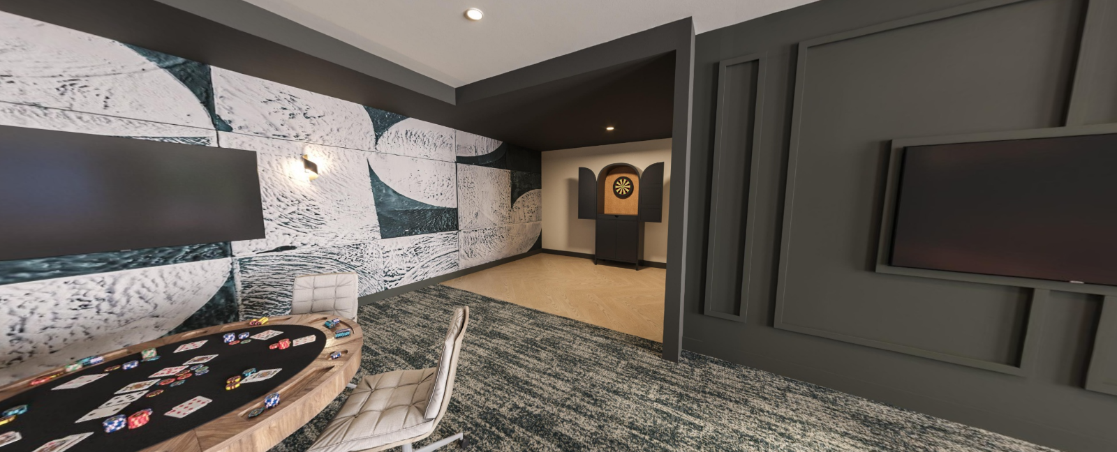 Modern living room with gray walls, patterned rug, and wall-mounted TV in a contemporary hallway view at Vela Park apartments in East Lake, Atlanta, GA.