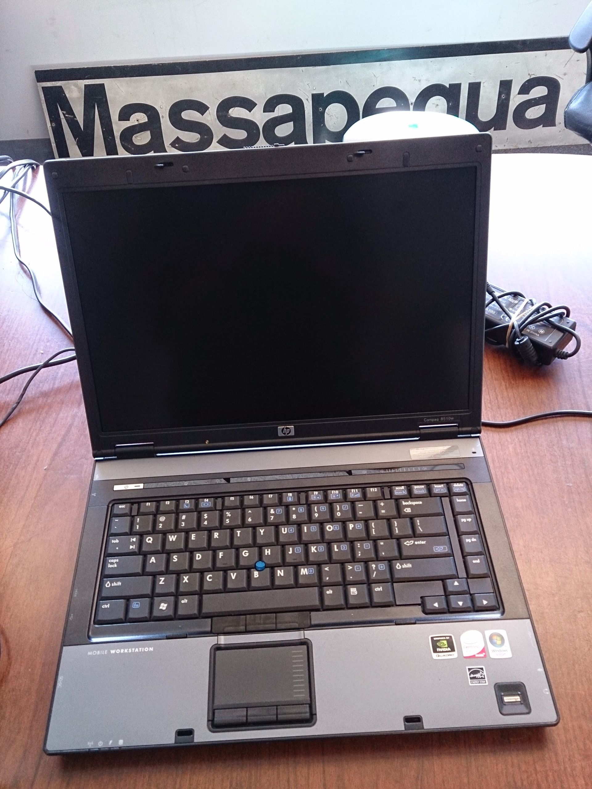 Laptop on a wooden surface with a 