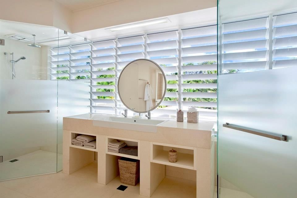 A Bathroom With A Sink, Mirror And Walk In Shower — Keilbach Kitchens In Garradunga, QLD