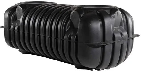 a large black plastic septic tank on a white background .
