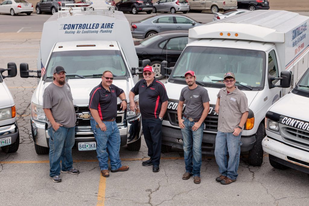 Five of Controlled Aire's HVAC Staff With the Business Trucks in Moberly, MO.