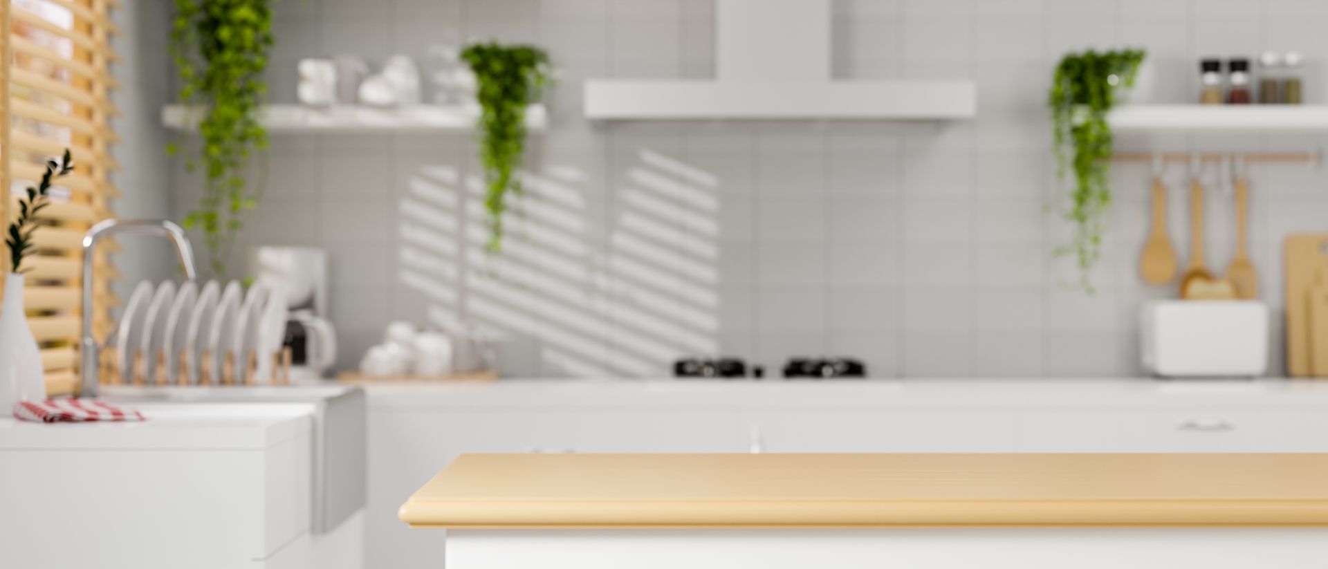 Kitchen with a wooden counter, sink, and stove. White cabinets, shelves with decor and hanging plants.
