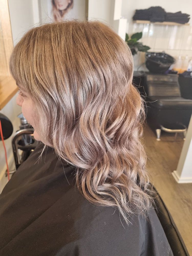 A Woman Is Sitting In A Chair In The Salon Shop — Arabella Hair Design in Sebastopol, VIC