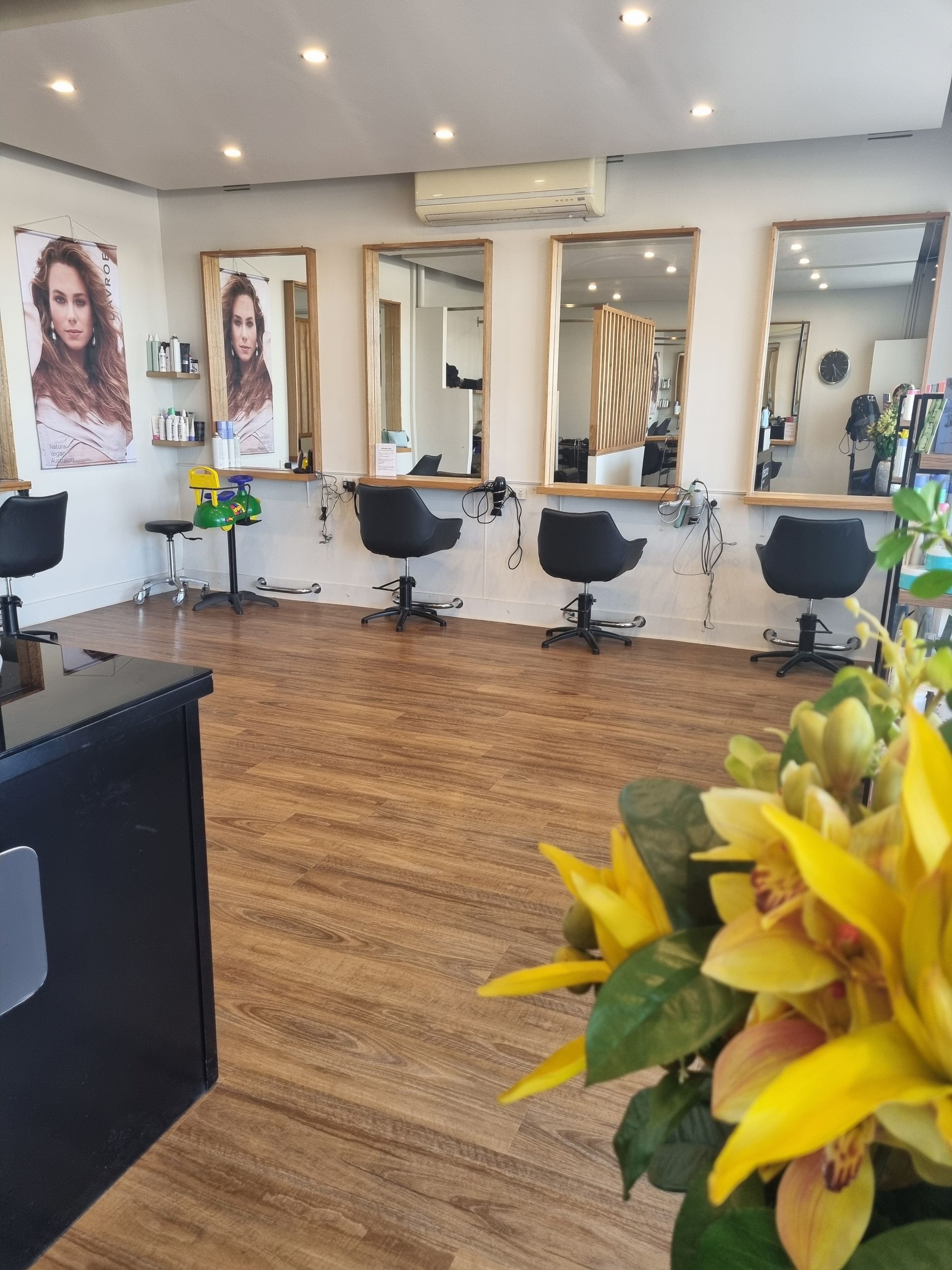 A Hair Salon With A Flower In The Foreground — Arabella Hair Design in Sebastopol, VIC