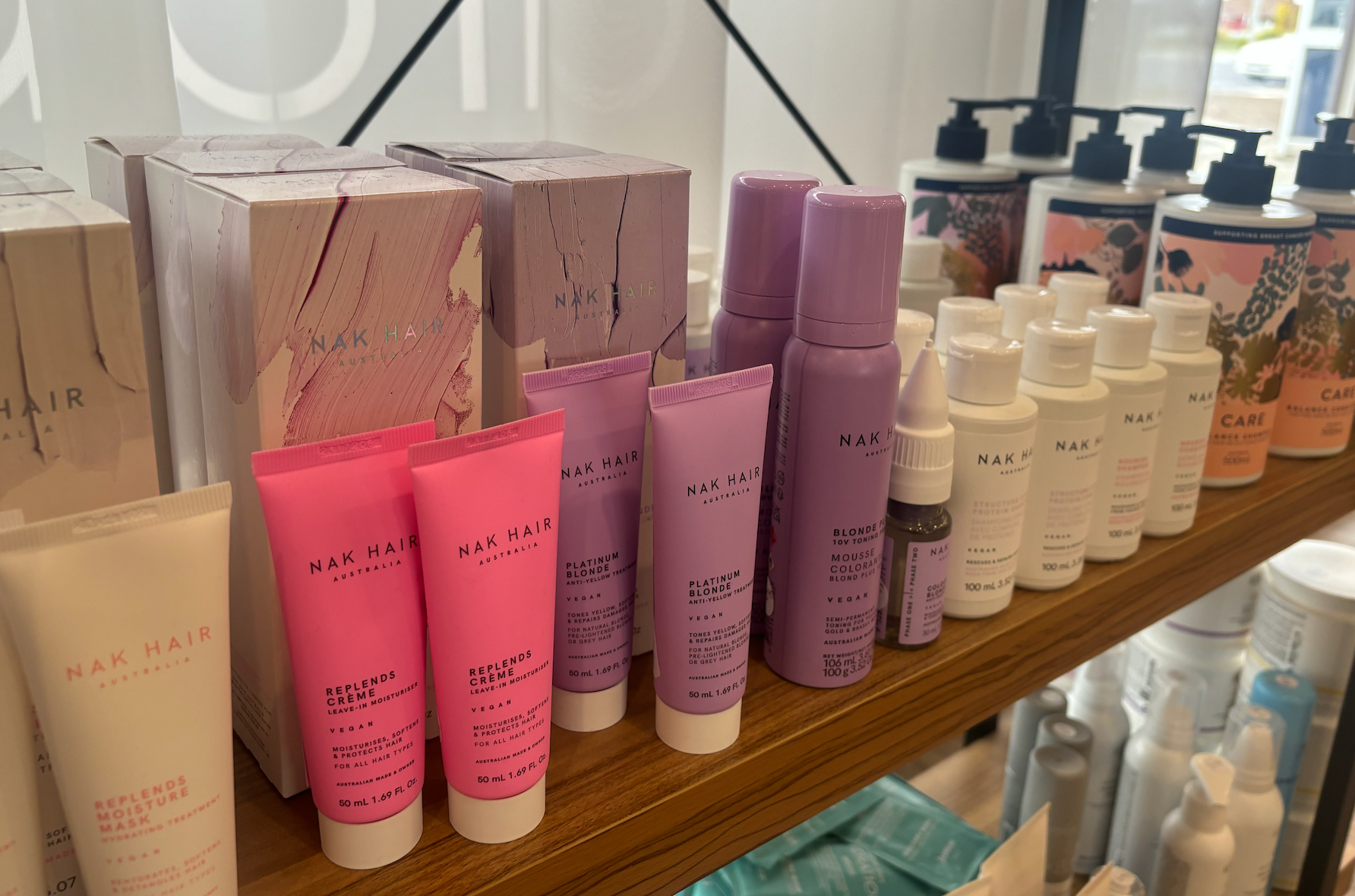 A Shelf Filled With Lots of Different Types of Cosmetics — Arabella Hair Design in Sebastopol, VIC