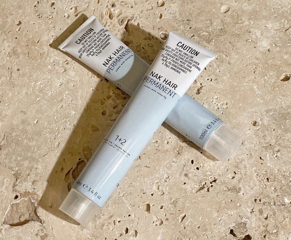 Two Tubes of Hair Dye with the Word Caution on Them — Arabella Hair Design in Sebastopol, VIC