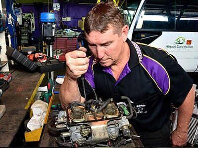 Mechanic Working on Engine — Motor Centre in Cairns, QLD