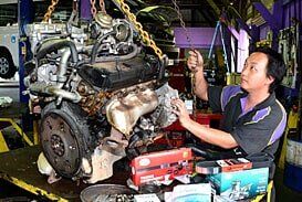 Man Working on Engine — Motor Centre in Cairns, QLD