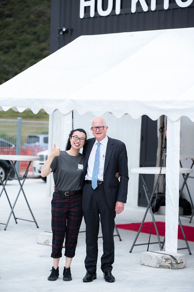 A White Tent with A Man and Woman Standing in Front | Upper Hutt, NZ | Hui Kitchens