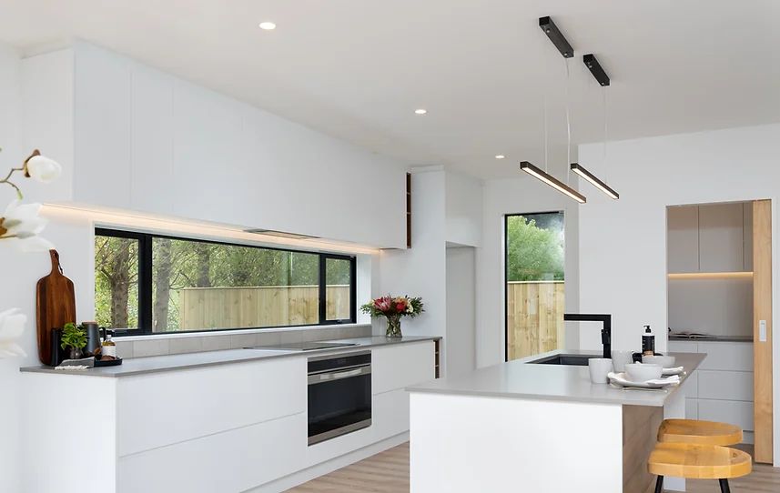 White Cabinets and Wooden Floors in A Modern Kitchen | Upper Hutt, NZ | Hui Kitchens