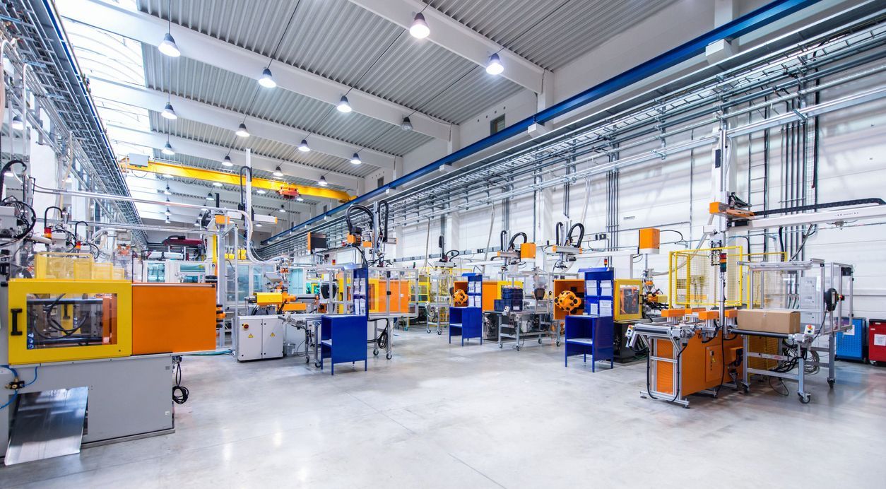 a large factory filled with lots of machines and machinery cleaned by flanders cleaning services