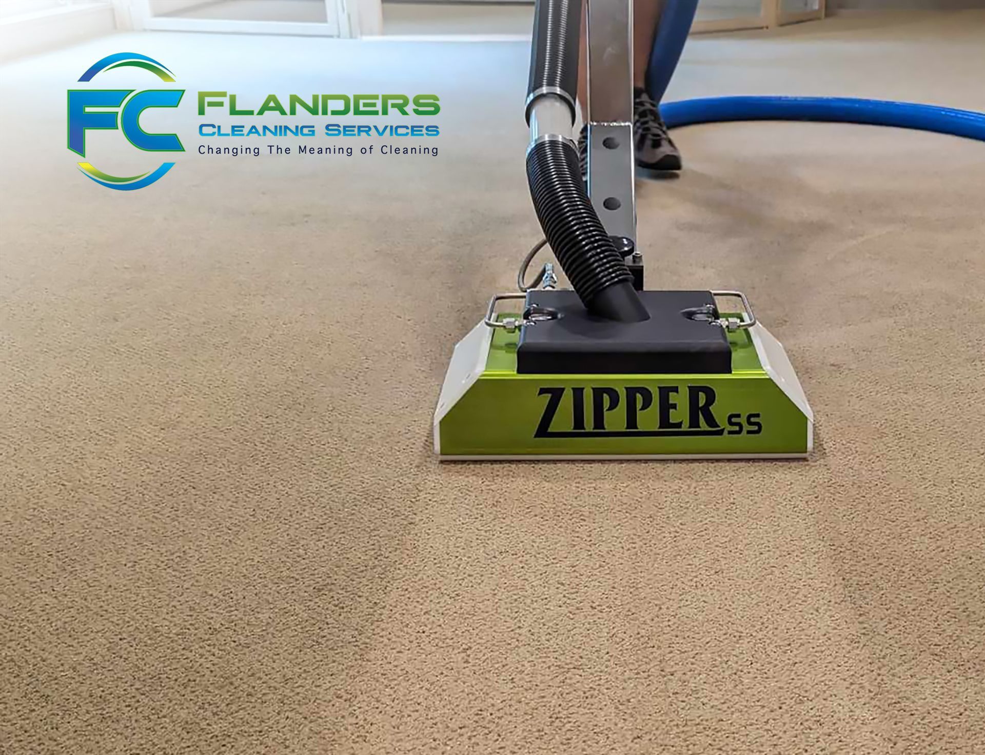 Carpet cleaning machine on beige carpet.