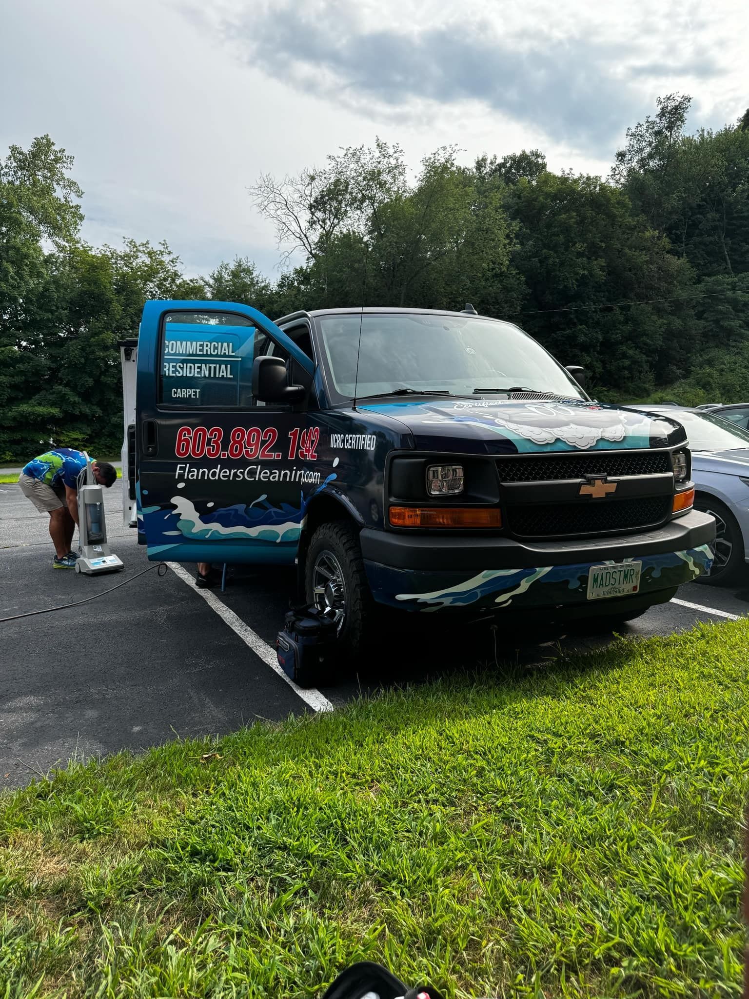 Flanders Steam Cleaning van is parked in a parking lot.