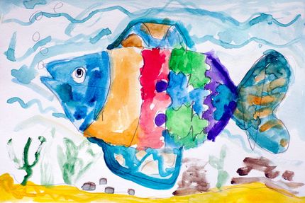A child 's painting of a colorful fish in the ocean