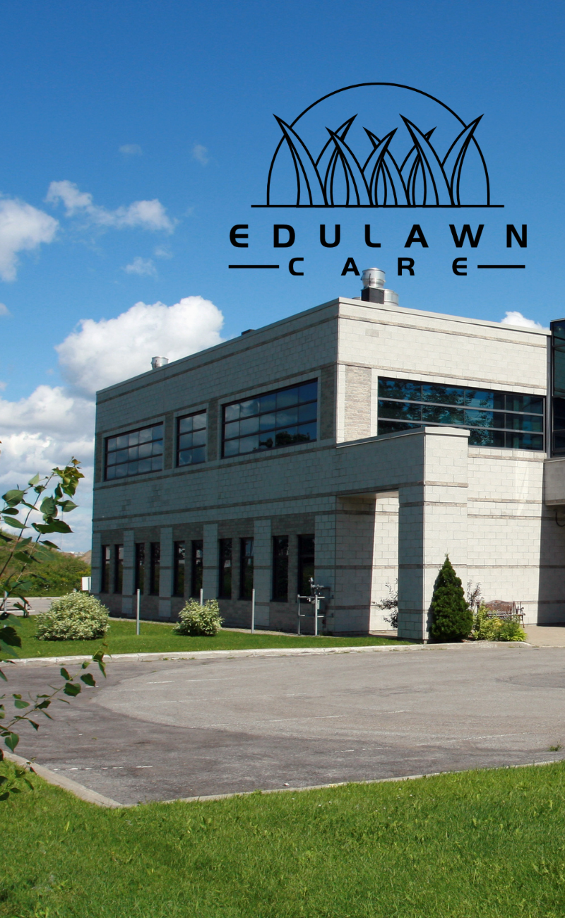 Commercial building property with black EduLawn Care logo on top of image