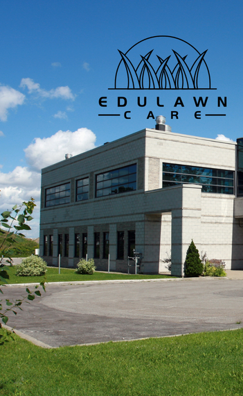 Commercial building property with black EduLawn Care logo on top of image