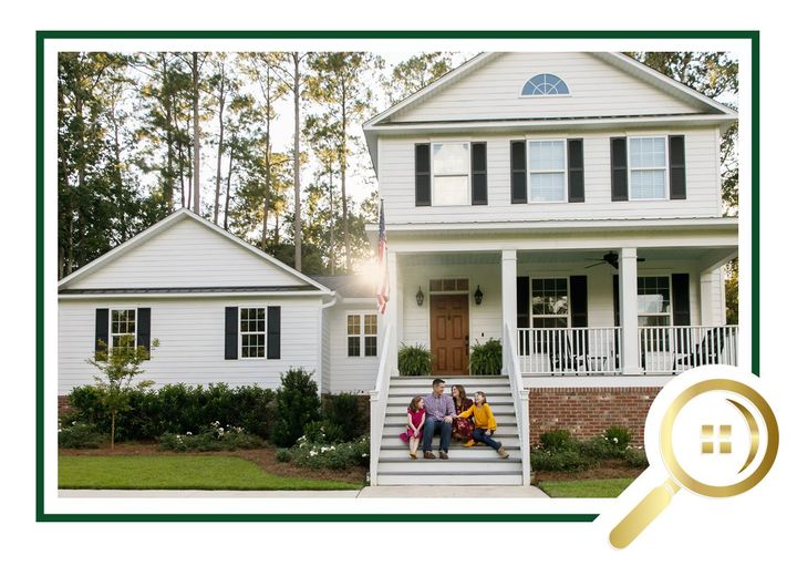 Full Home Inspection - Clouseau of Homes - Home Inspector White farmhouse and garage with porch, trees behind, and family sitting on front steps