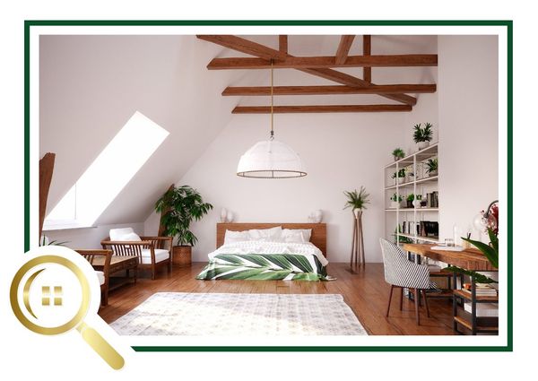 Home Construction Inspection - Clouseau of Homes - Home Inspector Bright airy bedroom with wooden beams, white pendant light, plants, and a desk near a skylight.