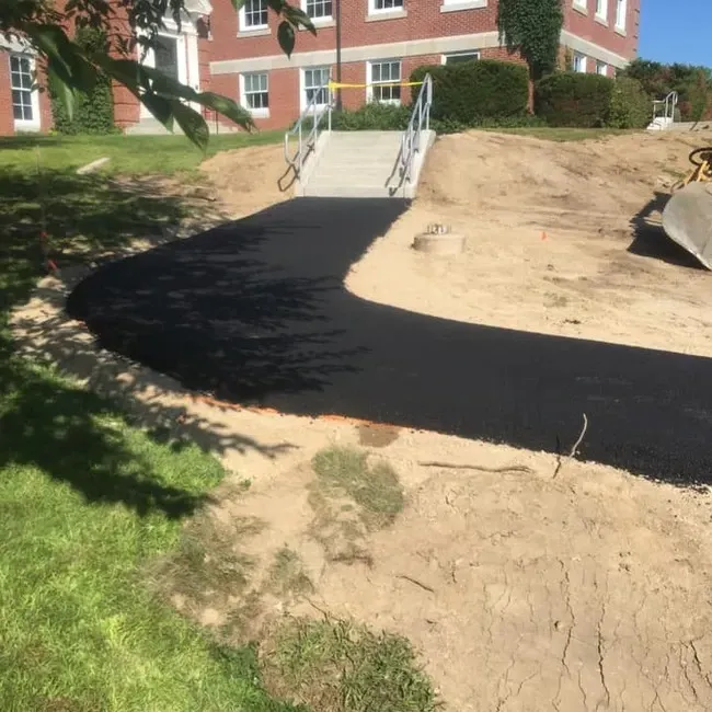 A brick building is in the background of a construction site
