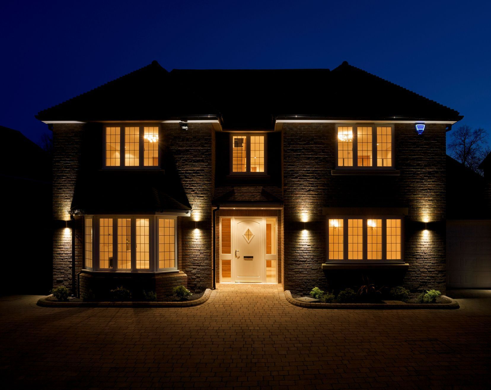 A man is installing an electrical outlet on a wall.