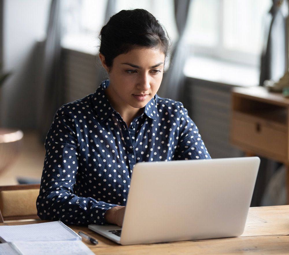 Woman Working Using Her Laptop — Tucker, GA — Taggart's Driving School