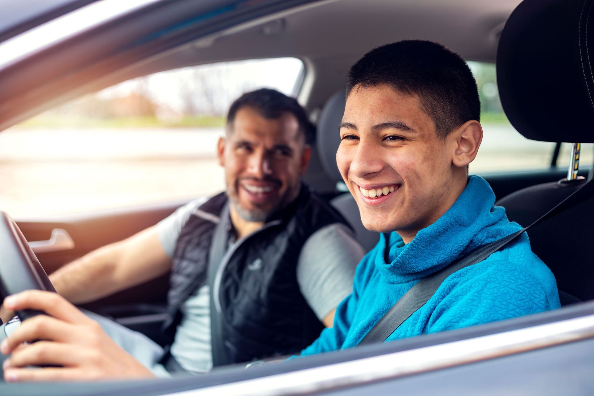 Teen driving lessons: young driver learning to drive with instructor, safe driving tips for teens, d