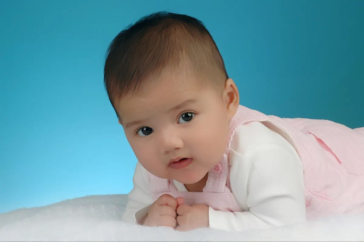 Cute Baby in a Blue Background