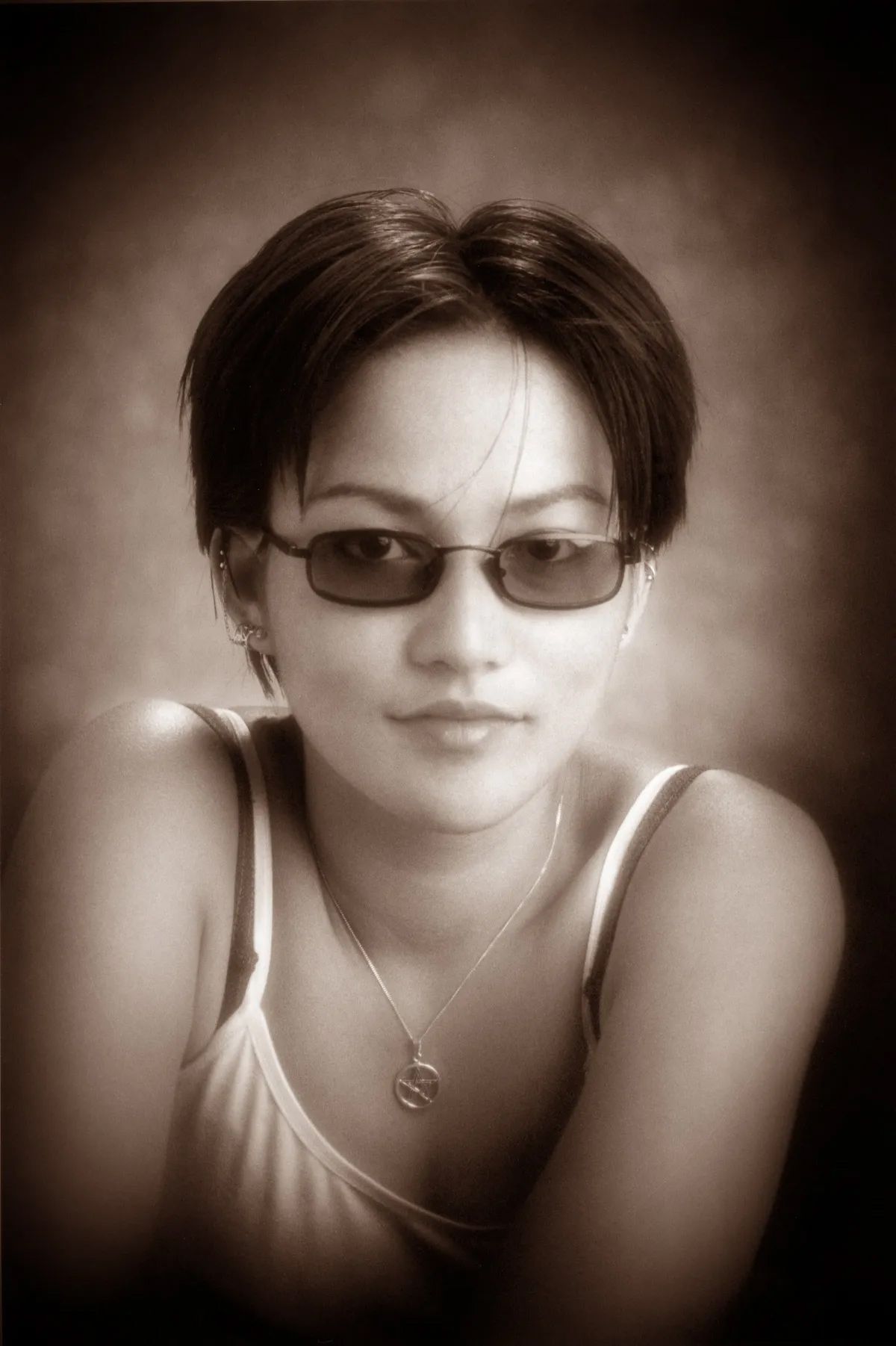 Woman with Short Dark Hair and Sunglasses