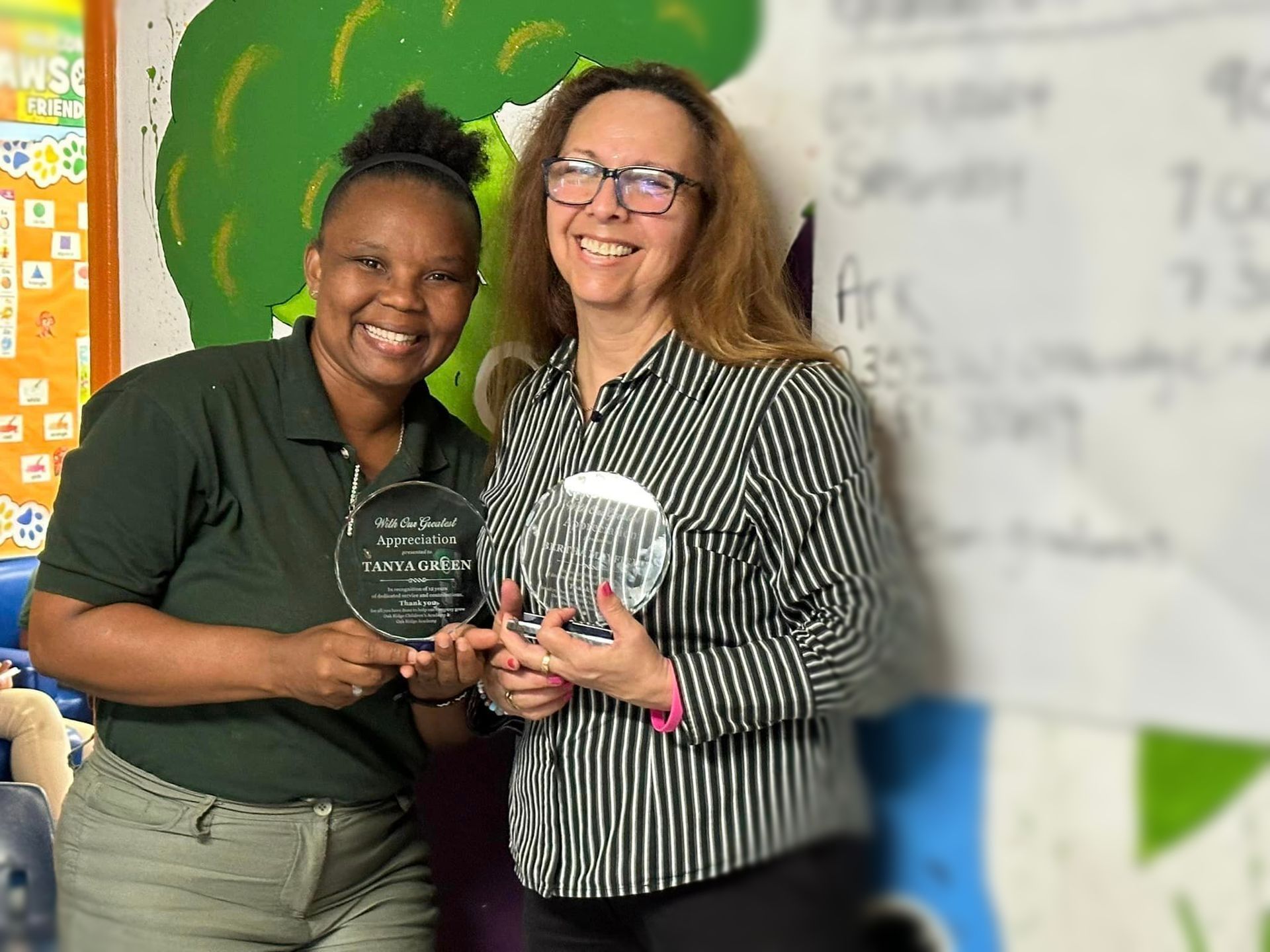 A group of children are sitting on the floor in a circle playing cards.