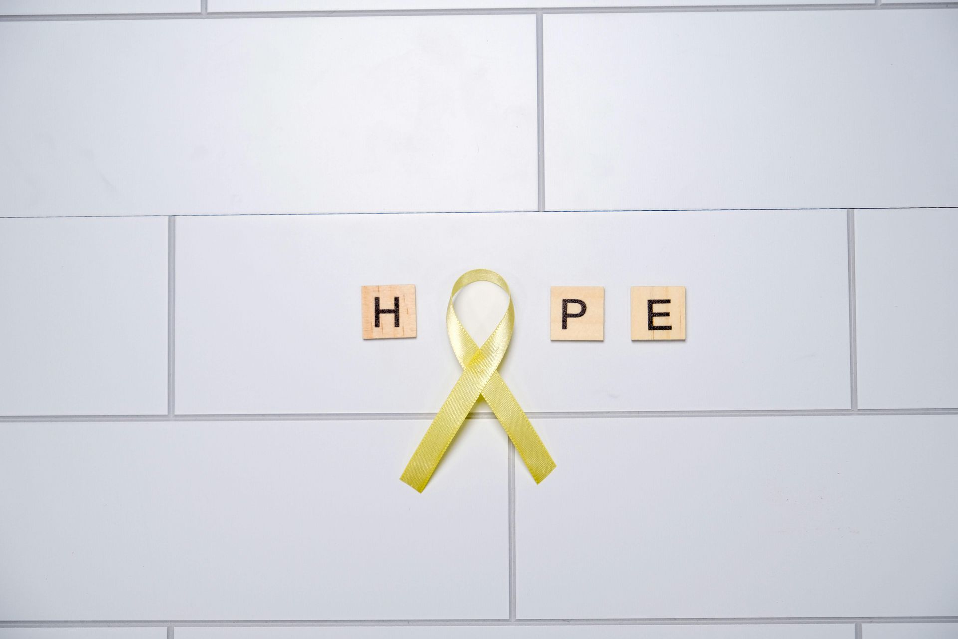 Yellow ribbon and the word 