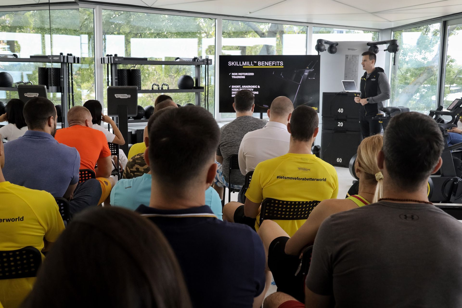a man is giving a presentation to a group of people