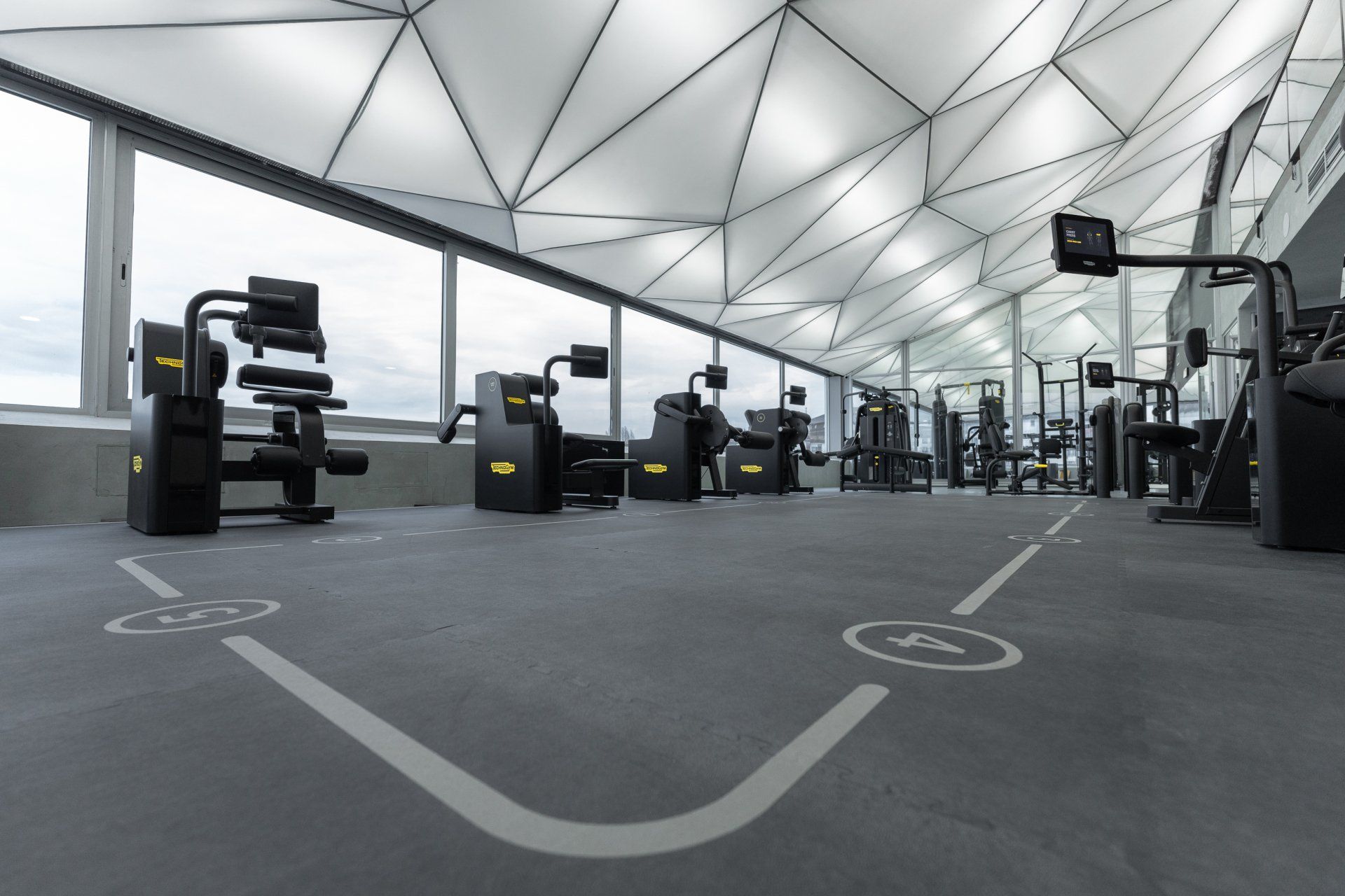 a gym with lots of exercise equipment
