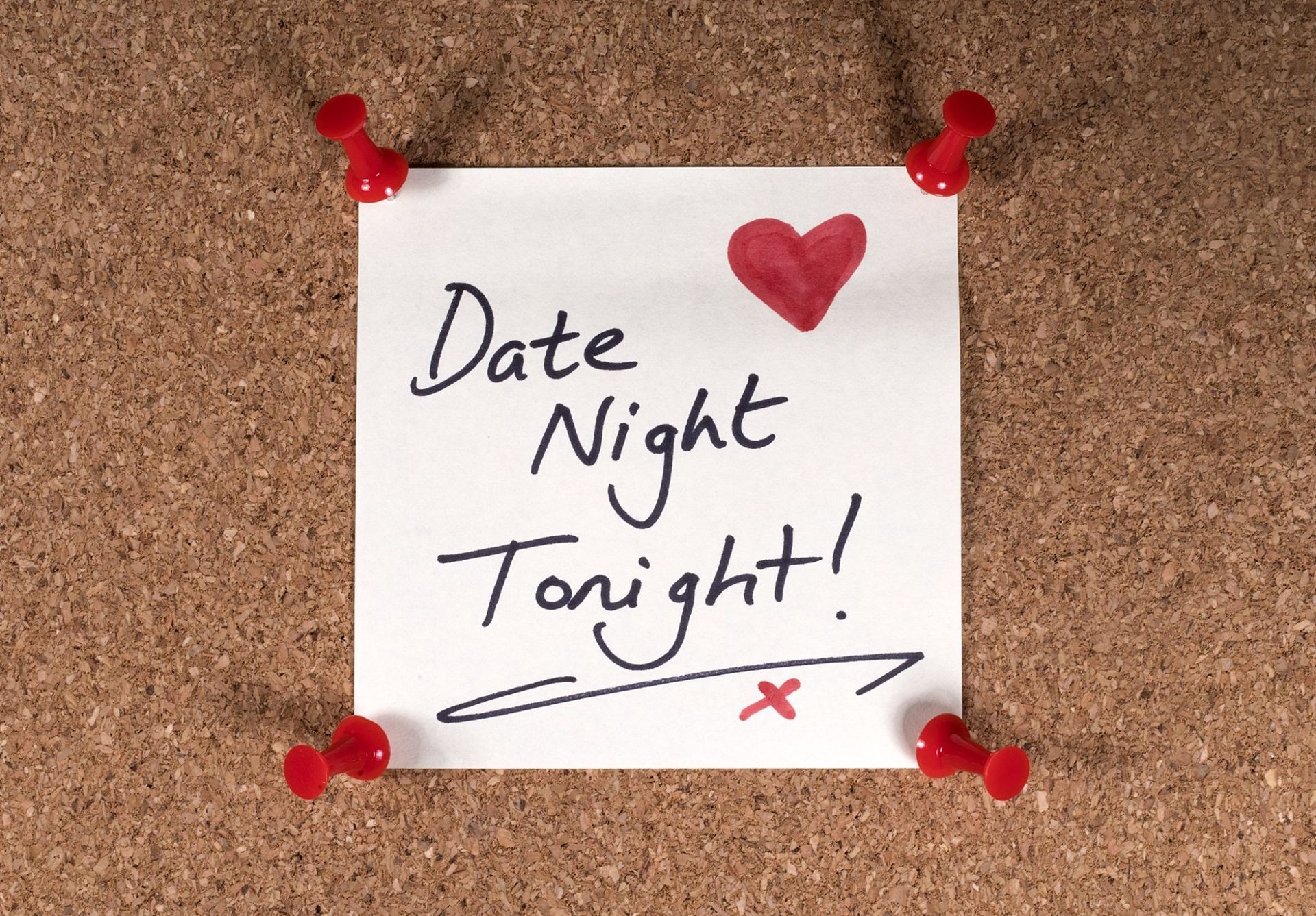 A note on a cork board that says date night tonight