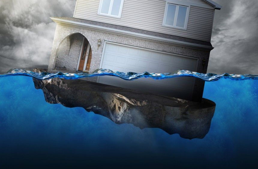 House sinking in water, dramatic dark sky, representing a financial crisis or natural disaster.