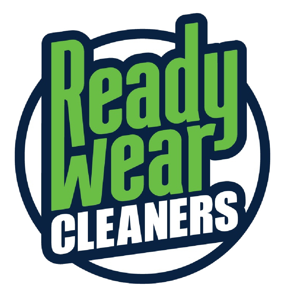 Logo for Ready Wear Cleaners with green text inside a navy blue circle.