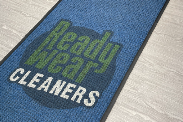 A blue logo floor mat with 