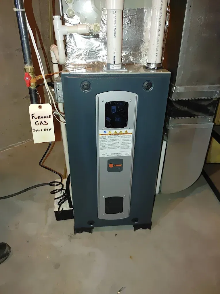 A furnace against a wall, labeled 