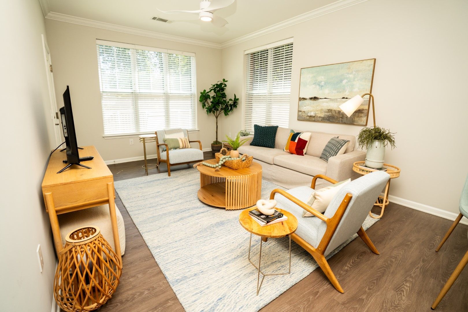 A bedroom with a bed and a ceiling fan