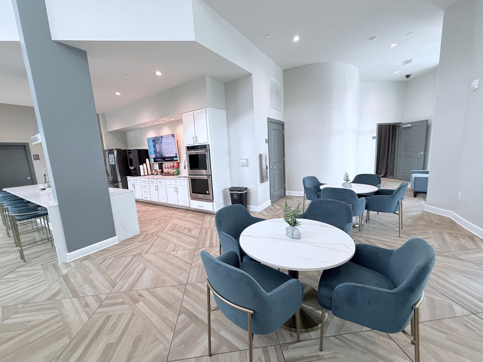 A bedroom with a bed and a ceiling fan