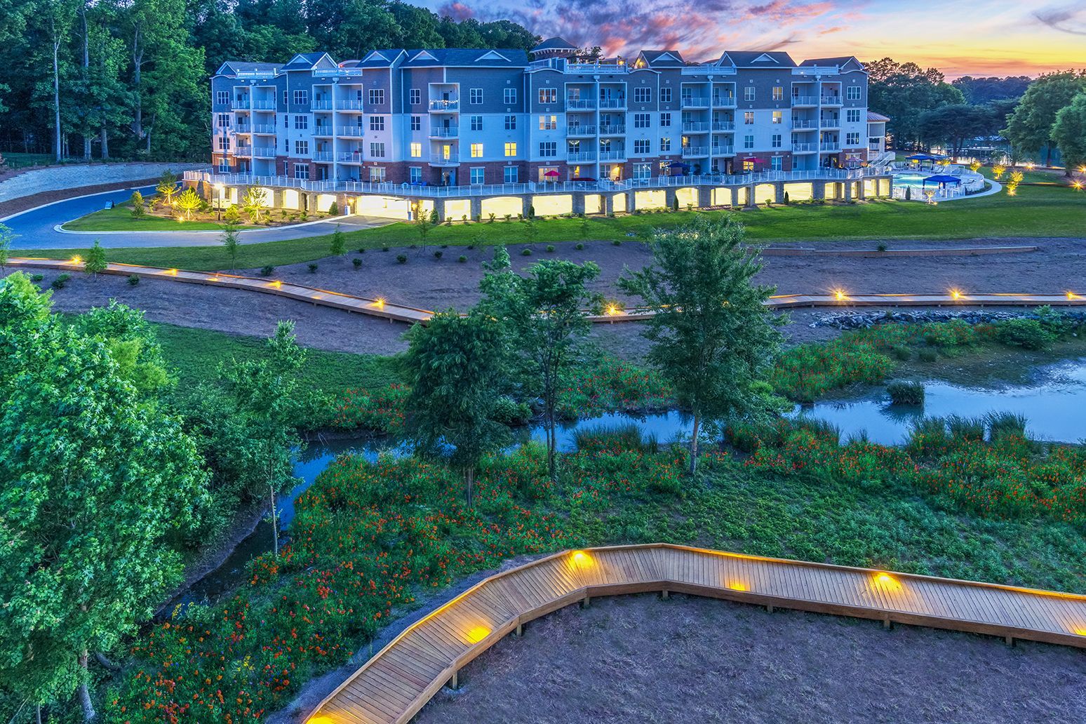 An aerial view of a building with a walkway in front of it at The Osprey in Mooresville, NC.