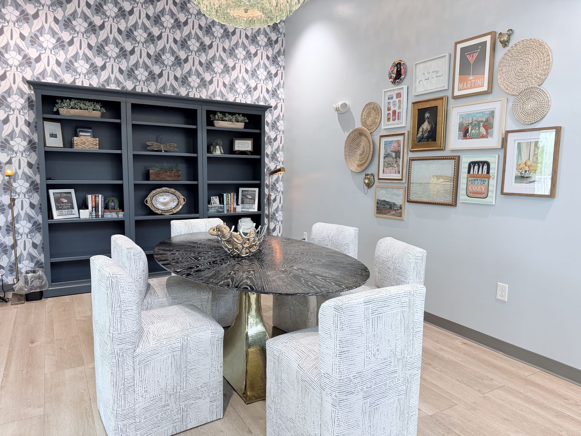 Scenic lakeside view with trees and a walking path.