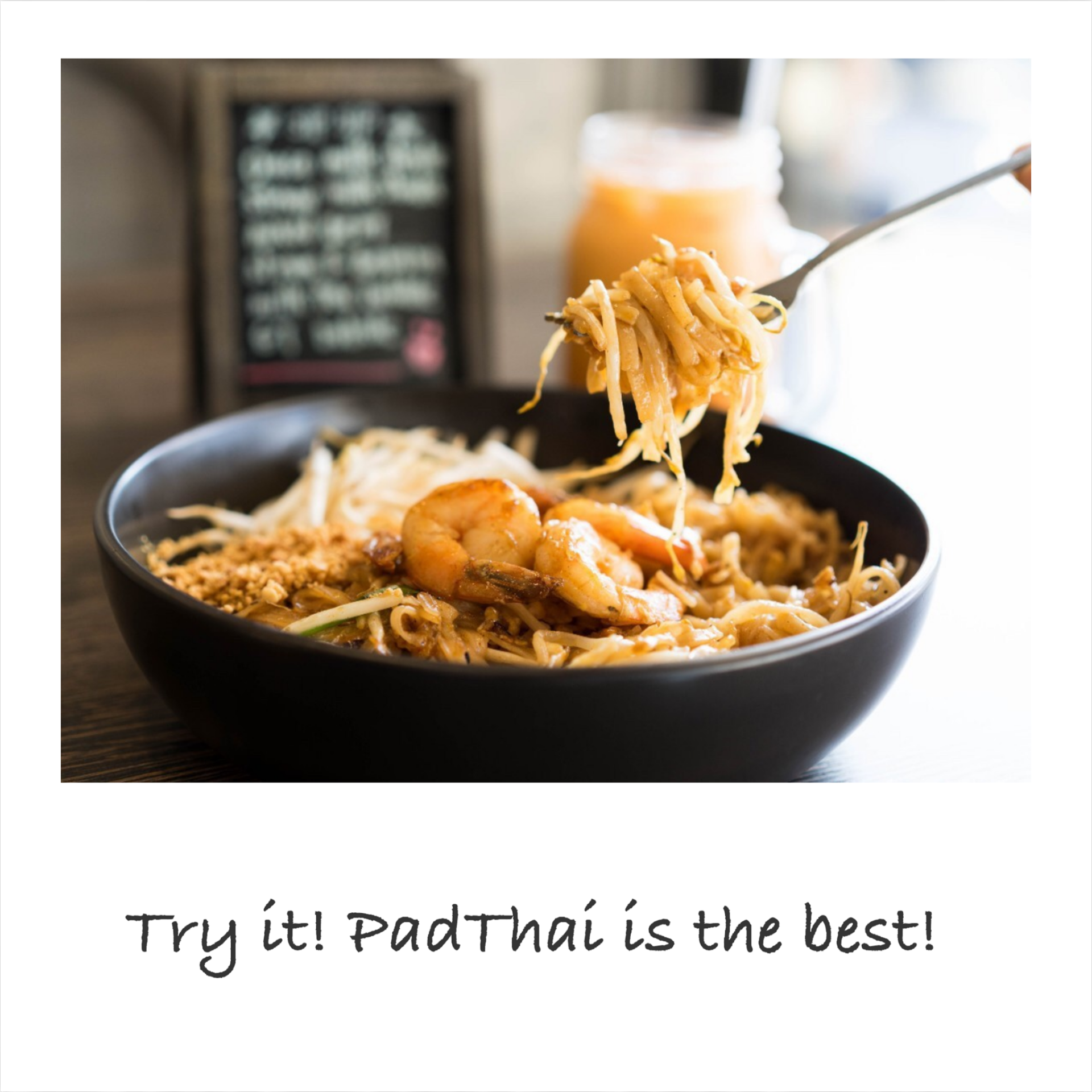 A bowl of pad thai with shrimp on a fork.