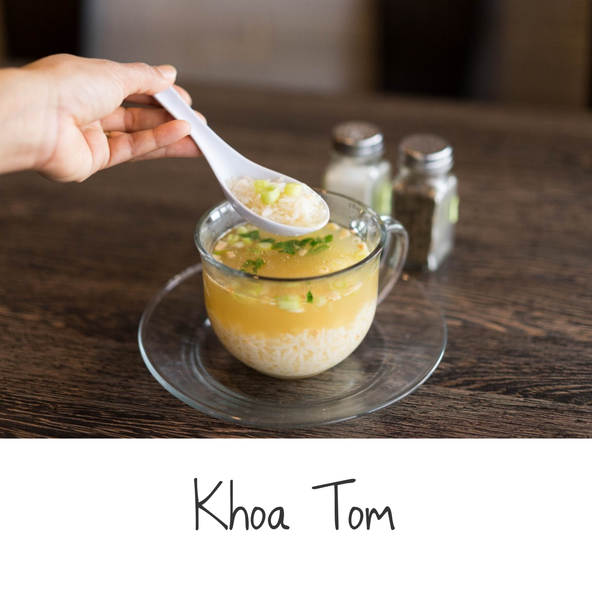 A person is holding a spoon over a cup of soup called khoa tom